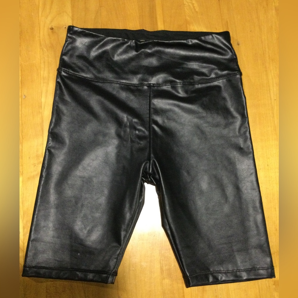 Shine Star pleather shorts with wide waistband. Polyester and spandex. Size S